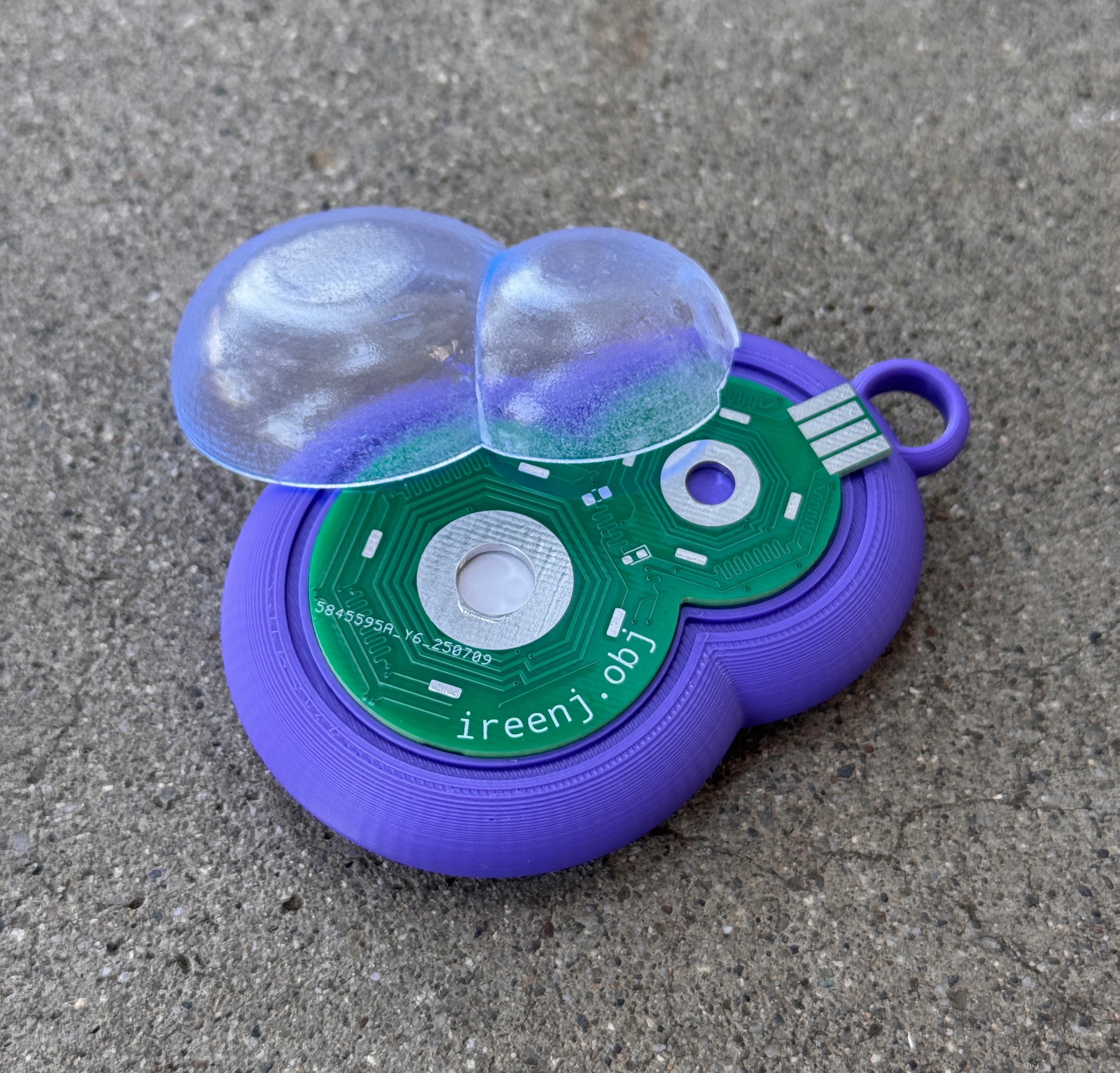 3D printed keychain with a custom PCB and a NFC tag behind, that opens my portfolio website.