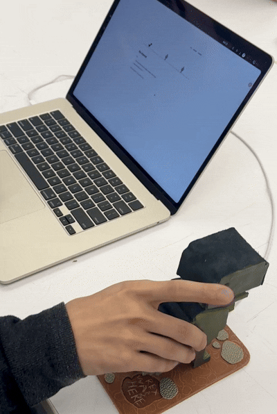 Person using the rex controller to play the trex game.